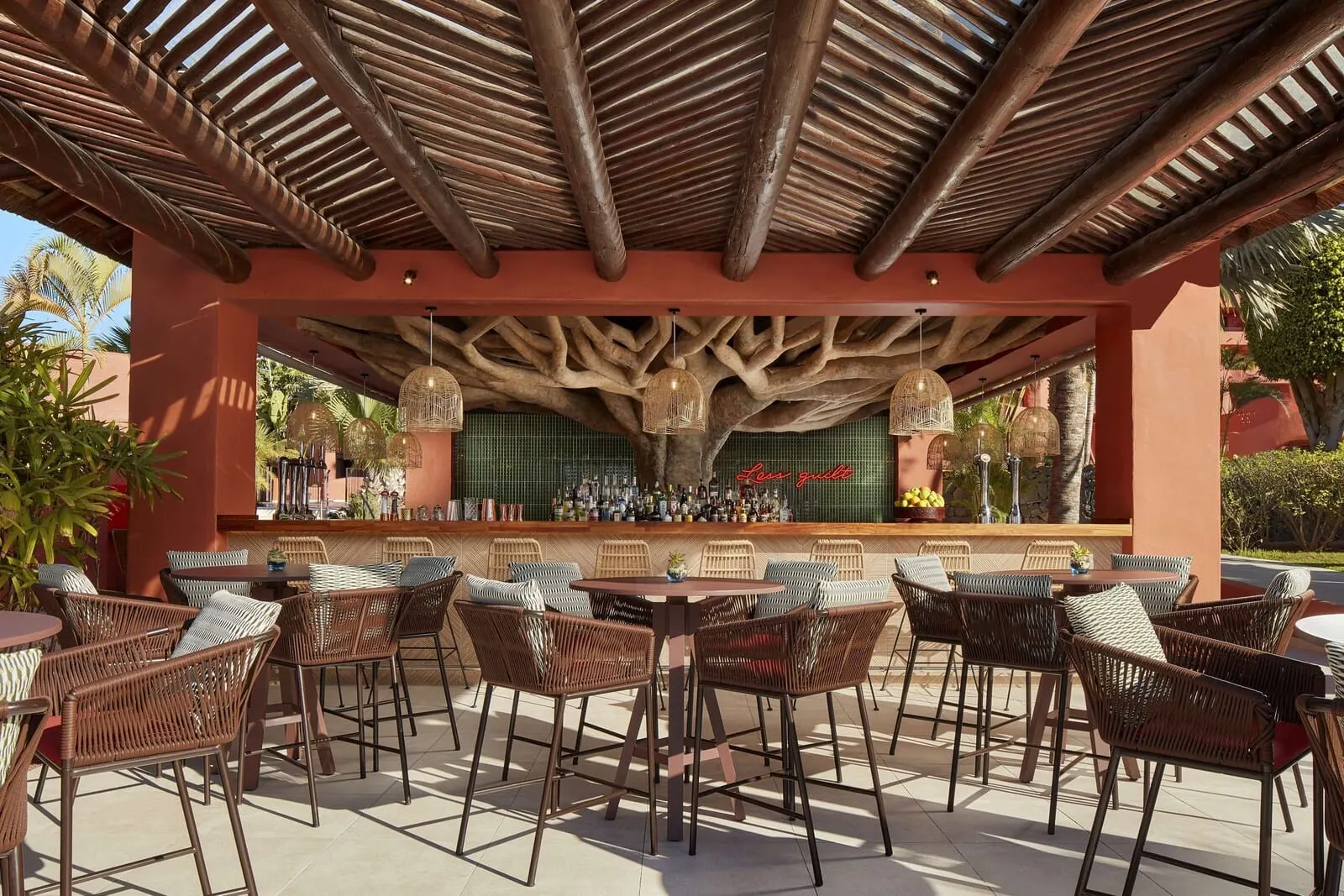 Tivoli La Caleta Tenerife Resort: An outdoor bar area with wicker furniture and a wooden ceiling structure