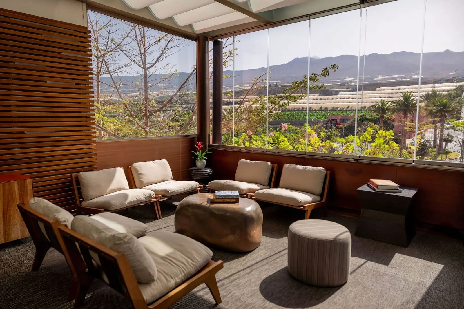 The Ritz-Carlton Tenerife, Abama: A modern room with a large window, wooden blinds