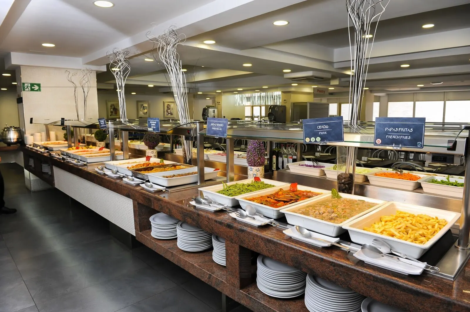 KN Aparthotel Columbus: A buffet with various food options including pasta, salads, and French fries