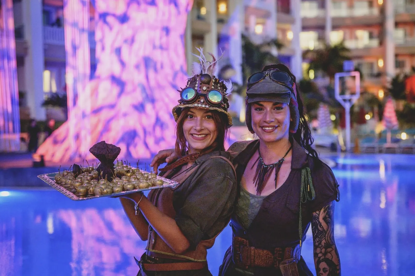 Bahia Principe Explore Fantasia: Two people in costume with a tray of food