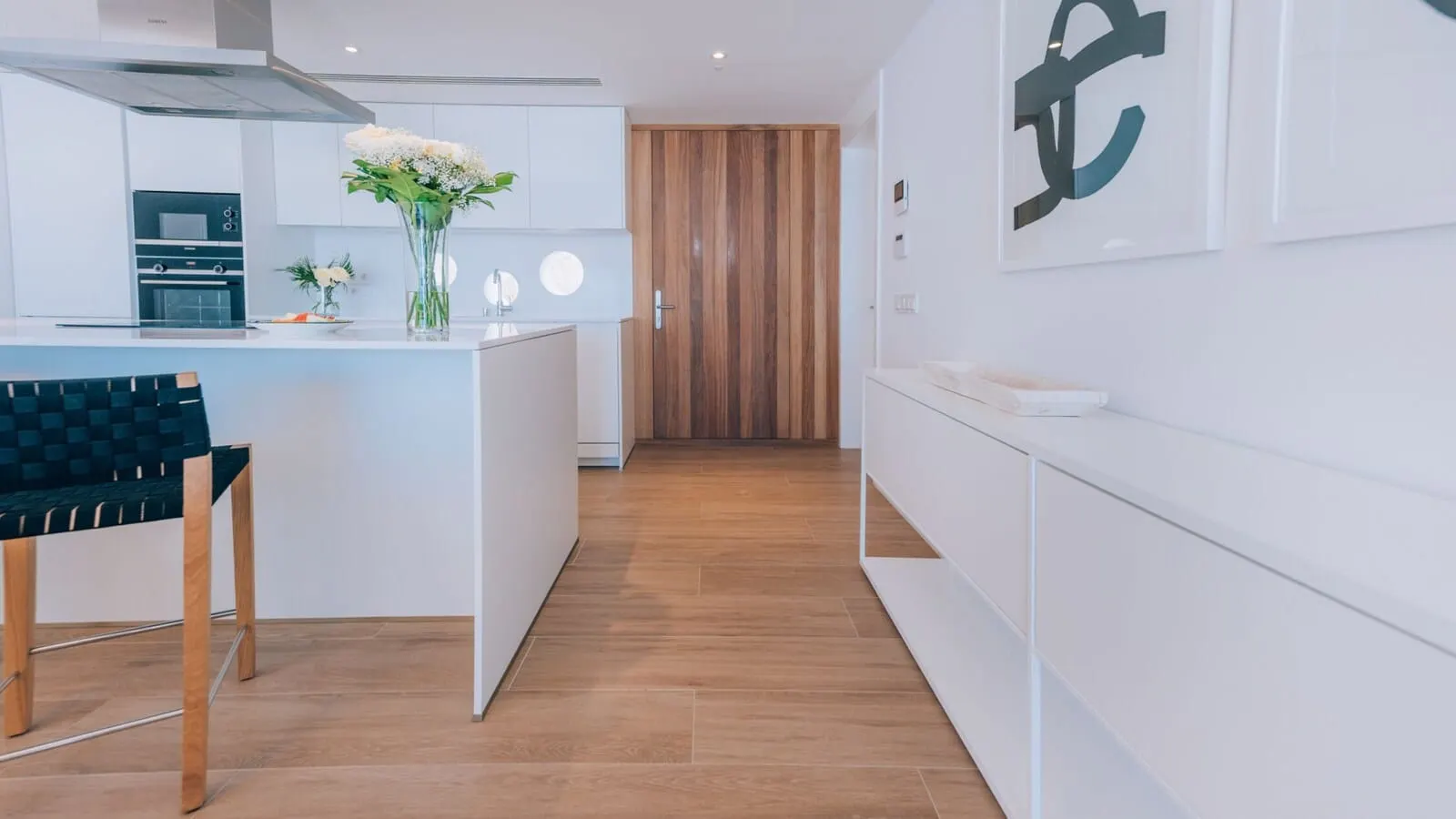 Los Jardines de Abama Suites & Villas: A modern kitchen with a central island, wooden flooring