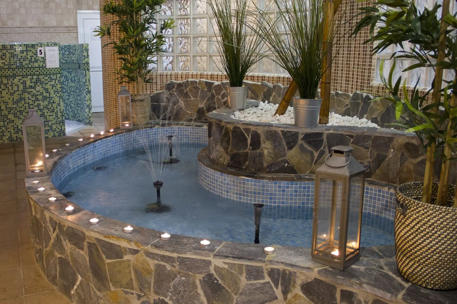 Best Semiramis: A circular hot tub with stone walls and tiled flooring