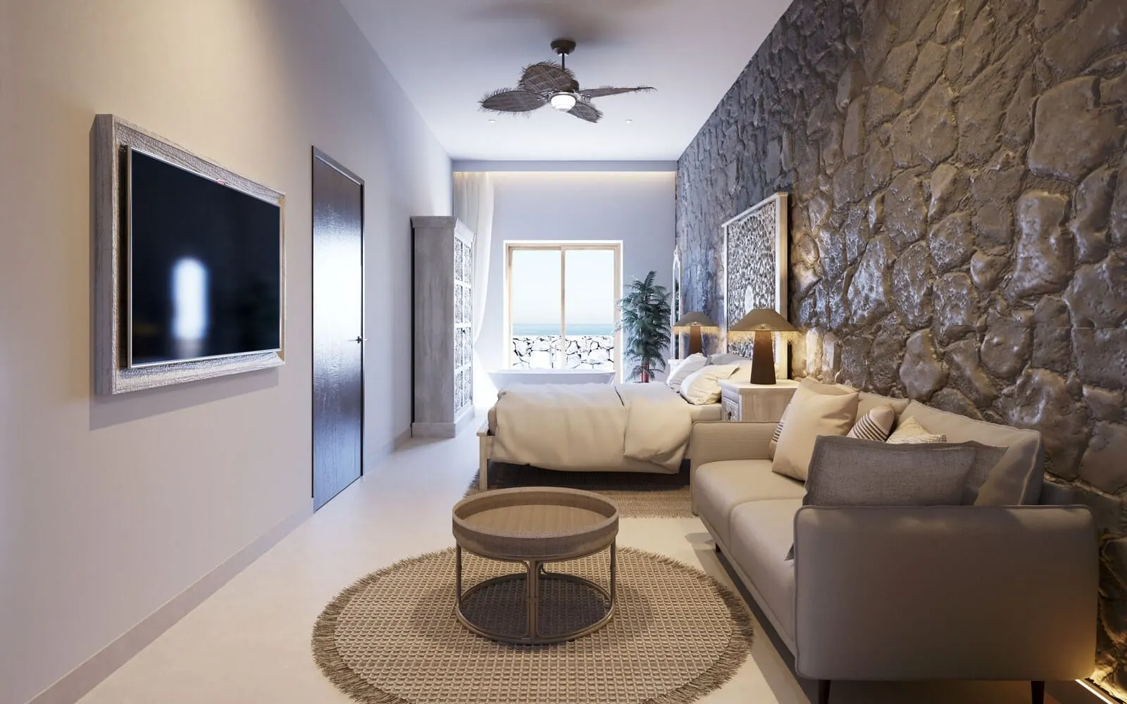 Costa Mágica Boutique Hotel: A modern living room with a stone wall, a ceiling fan, a large TV, a sofa