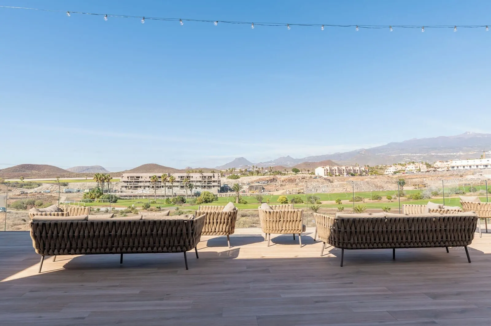 Amarilla Golf Residences: Outdoor seating with a view of a residential area and mountains