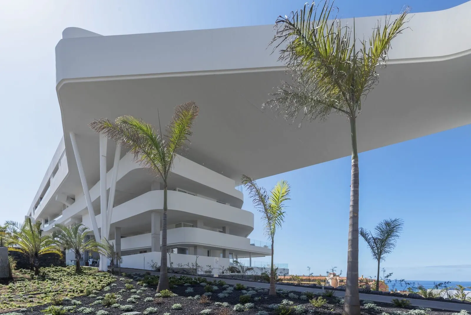 Royal Hideaway Corales Suites: A modern multi-story building with a unique architectural design