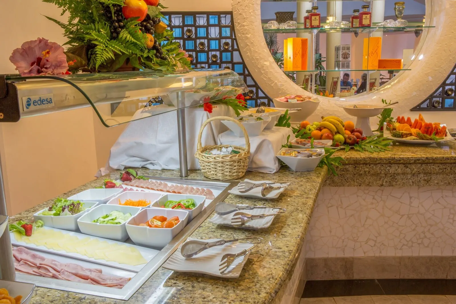 Ona Hollywood Mirage: A buffet setup with various food items and utensils