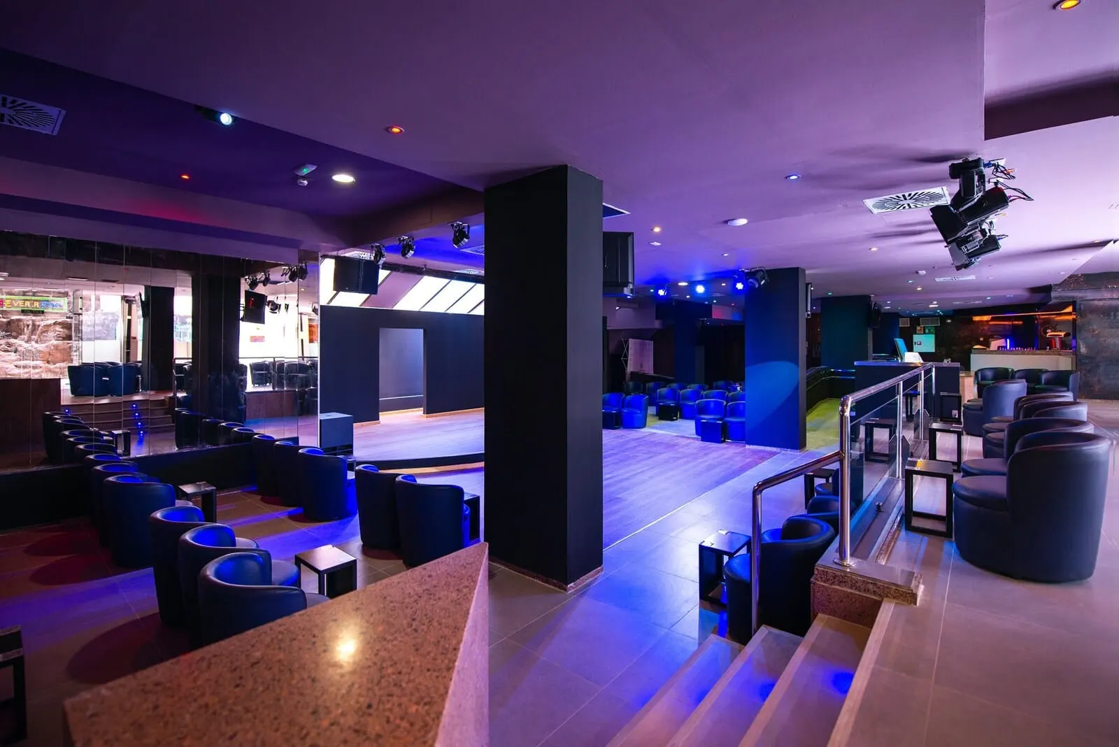 Paradise Park Fun Lifestyle Hotel: A modern hotel lobby with a seating area, a stage, and a bar