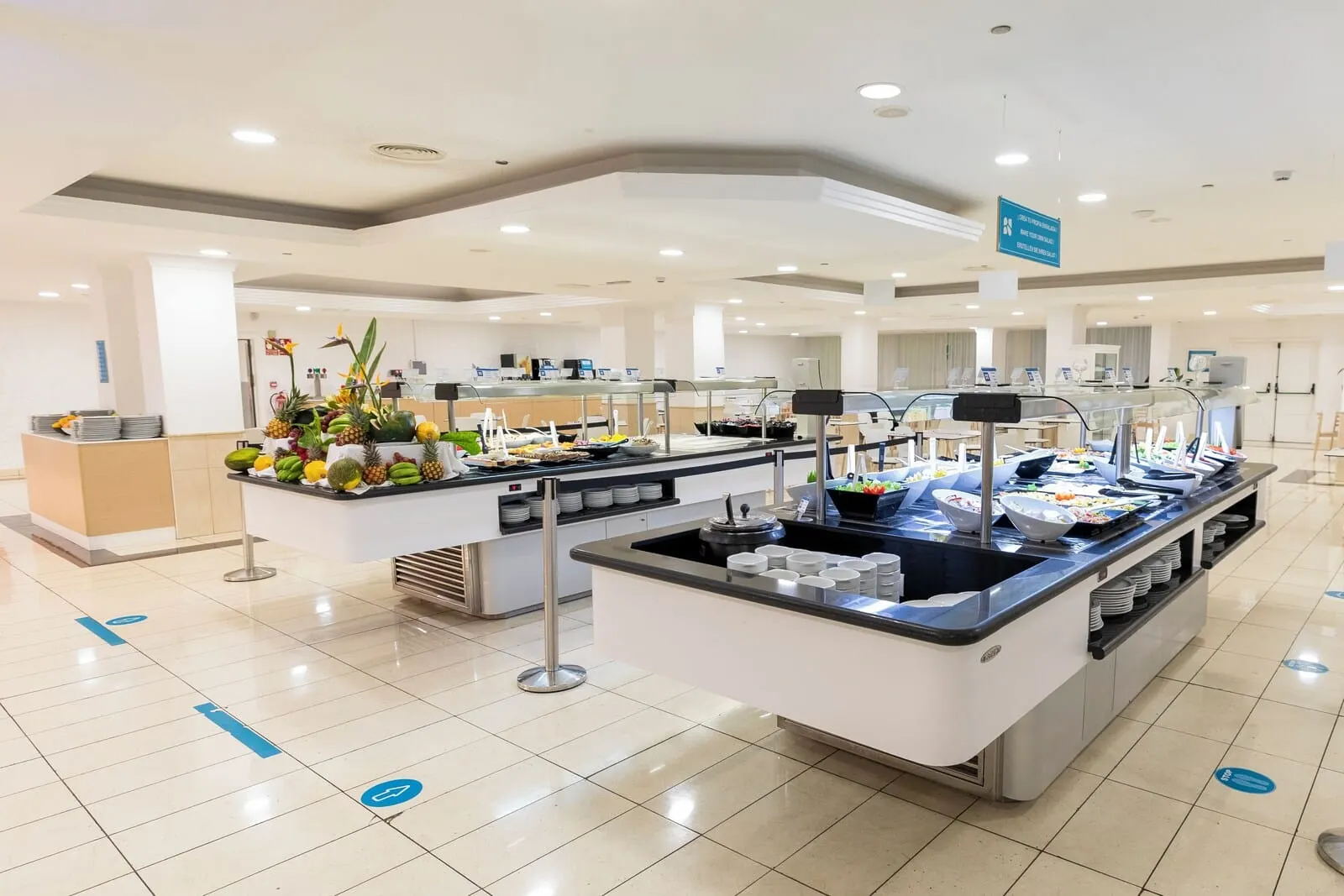 BLUESEA Interpalace: A buffet area with various food items and a clean, tiled floor