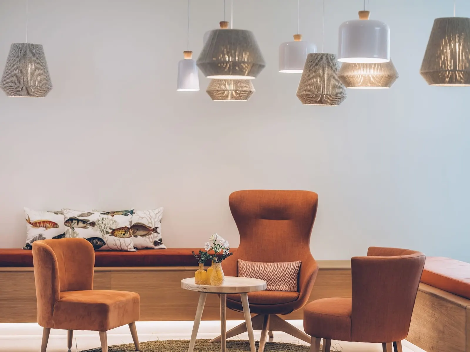 Iberostar Selection Sábila: A modern living room with a sofa, two armchairs, a small round table