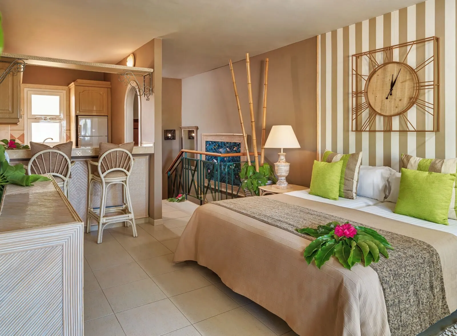 Gran Oasis Resort: A well-lit, spacious room with a bed, seating area, and a kitchen