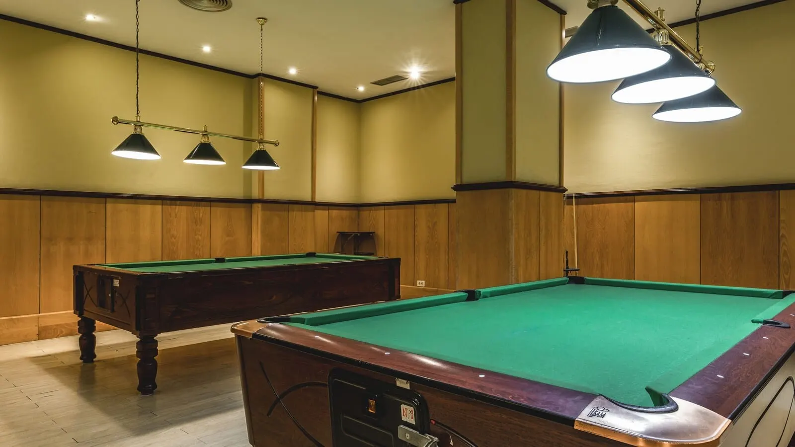 Be Live Adults Only Tenerife: A pool table with a wooden finish and a green felt surface