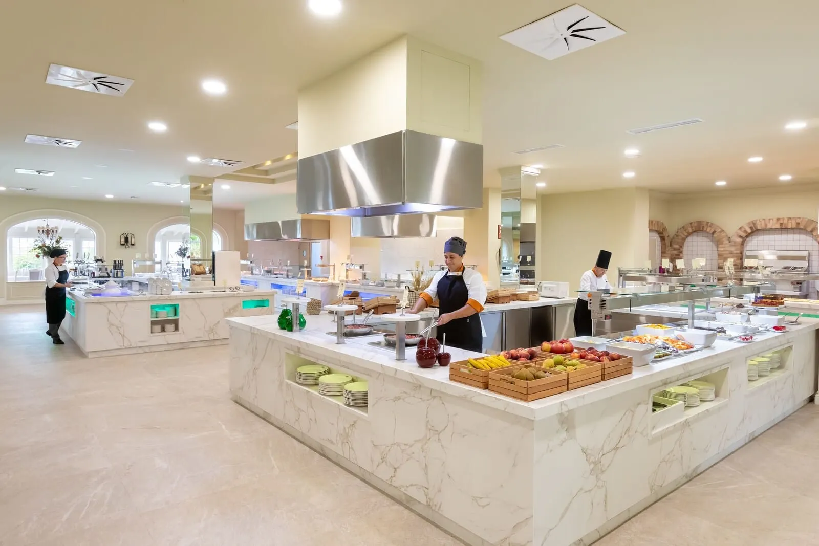 Hotel Riu Garoé: A modern hotel kitchen with marble countertops, stainless steel appliances
