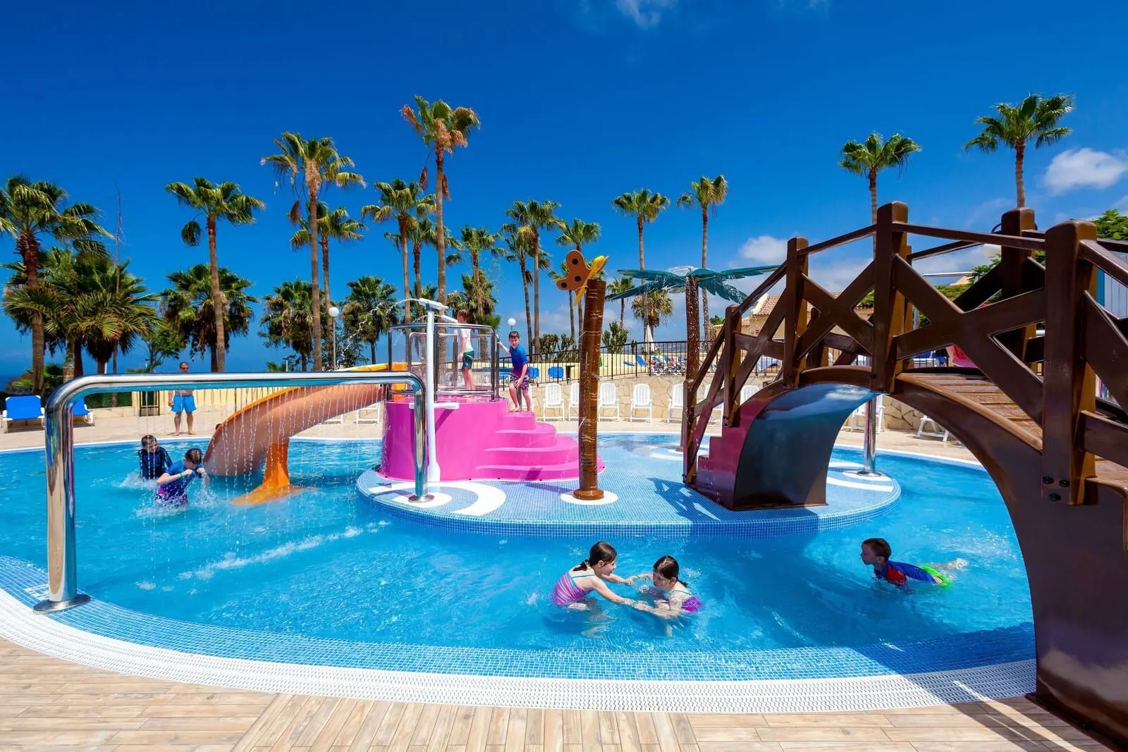 Tagoro Family & Fun Costa Adeje: A swimming pool area with a slide and a water play structure