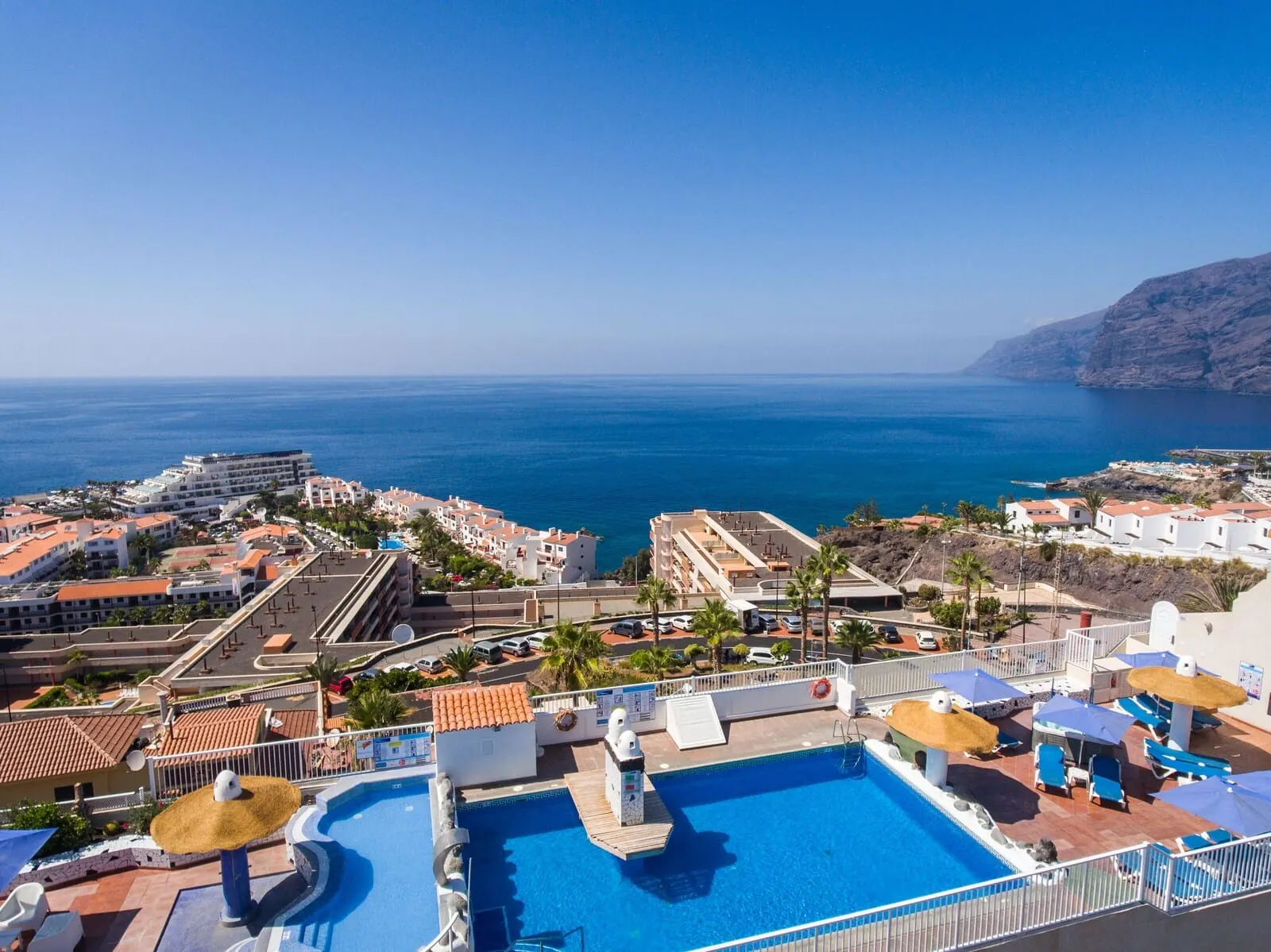 Vigilia Park: A resort with a swimming pool, beach view, and multiple buildings