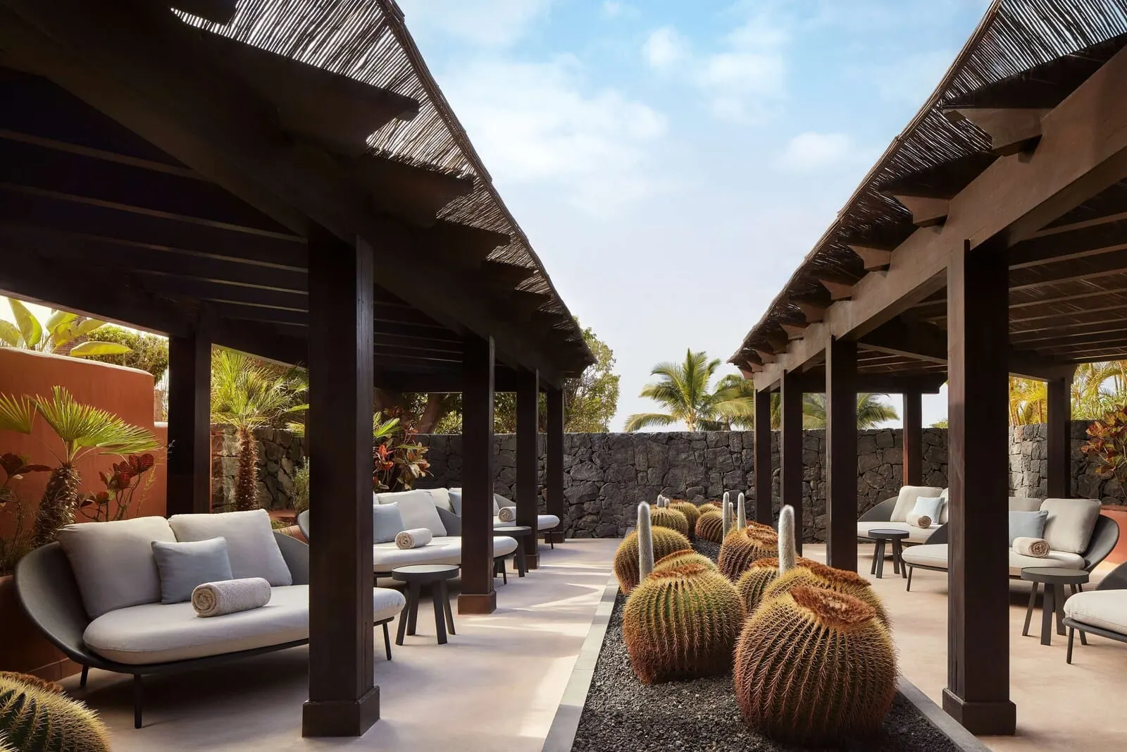 Tivoli La Caleta Tenerife Resort: A covered outdoor seating area with sofas and tables