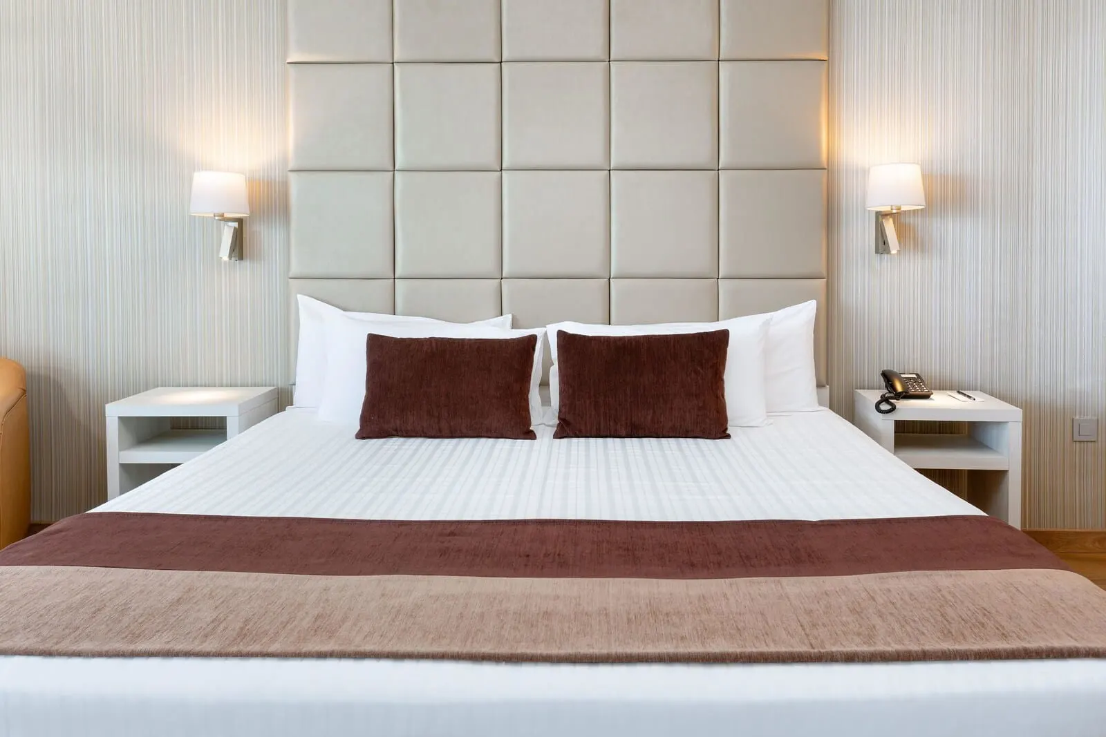 Best Semiramis: A hotel room with a large bed, two nightstands, a padded headboard
