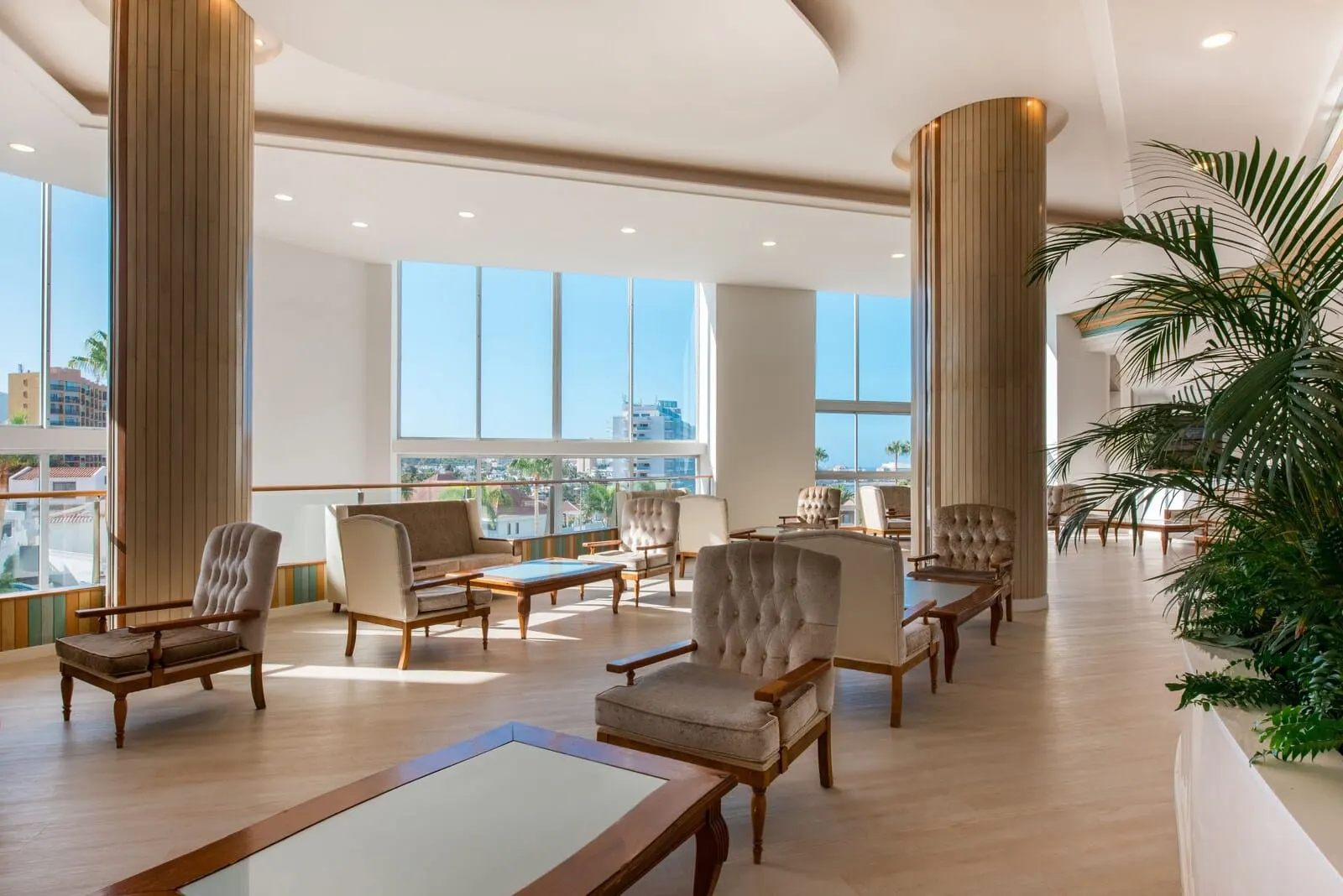 Iberostar Waves Bouganville Playa: A spacious lobby with high ceilings, large windows
