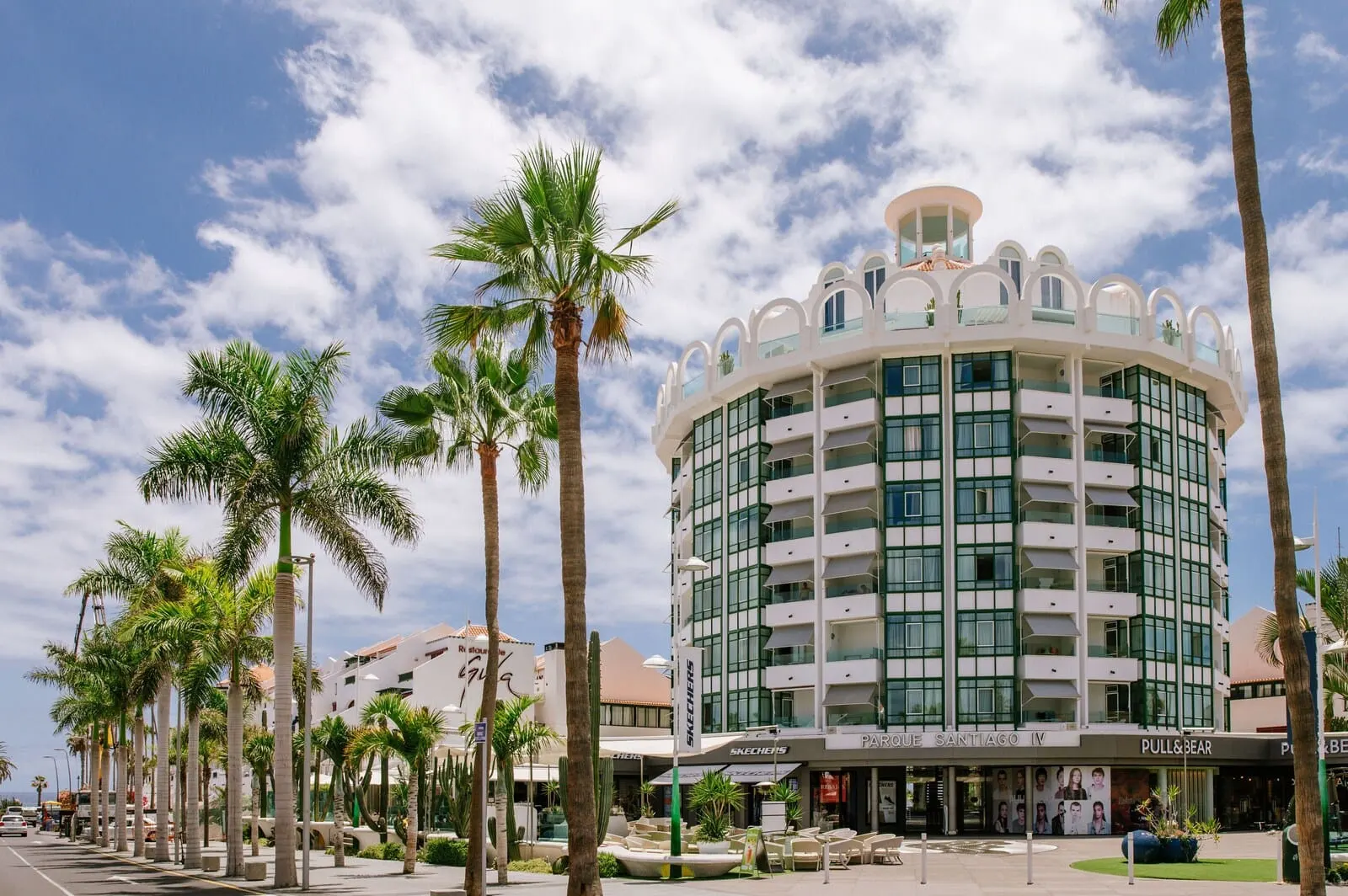 Parque Santiago IV: A multi-story hotel with a modern design, featuring balconies and large windows