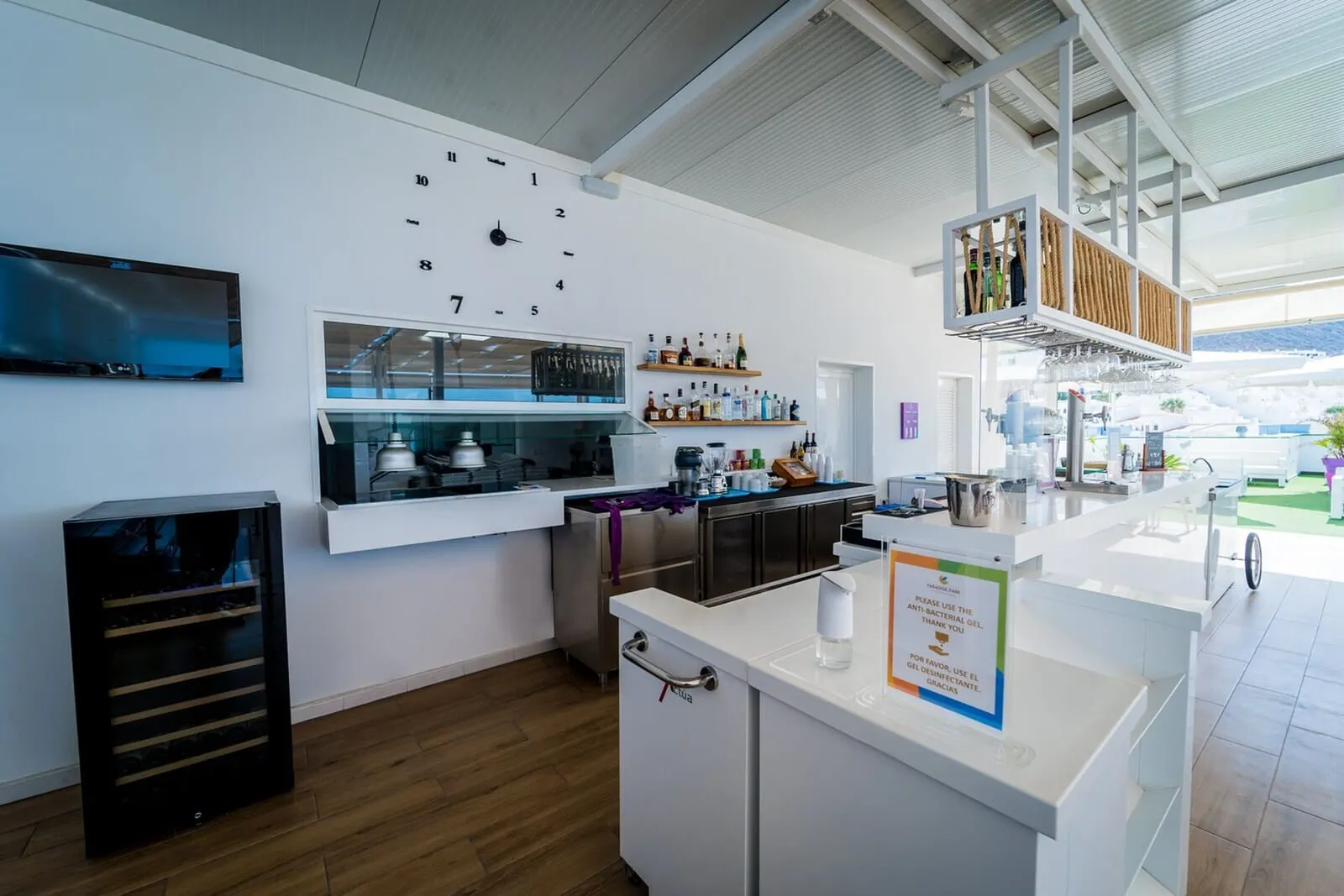 Paradise Park Fun Lifestyle Hotel: A modern kitchen with a built-in oven, a coffee machine, and a wine rack