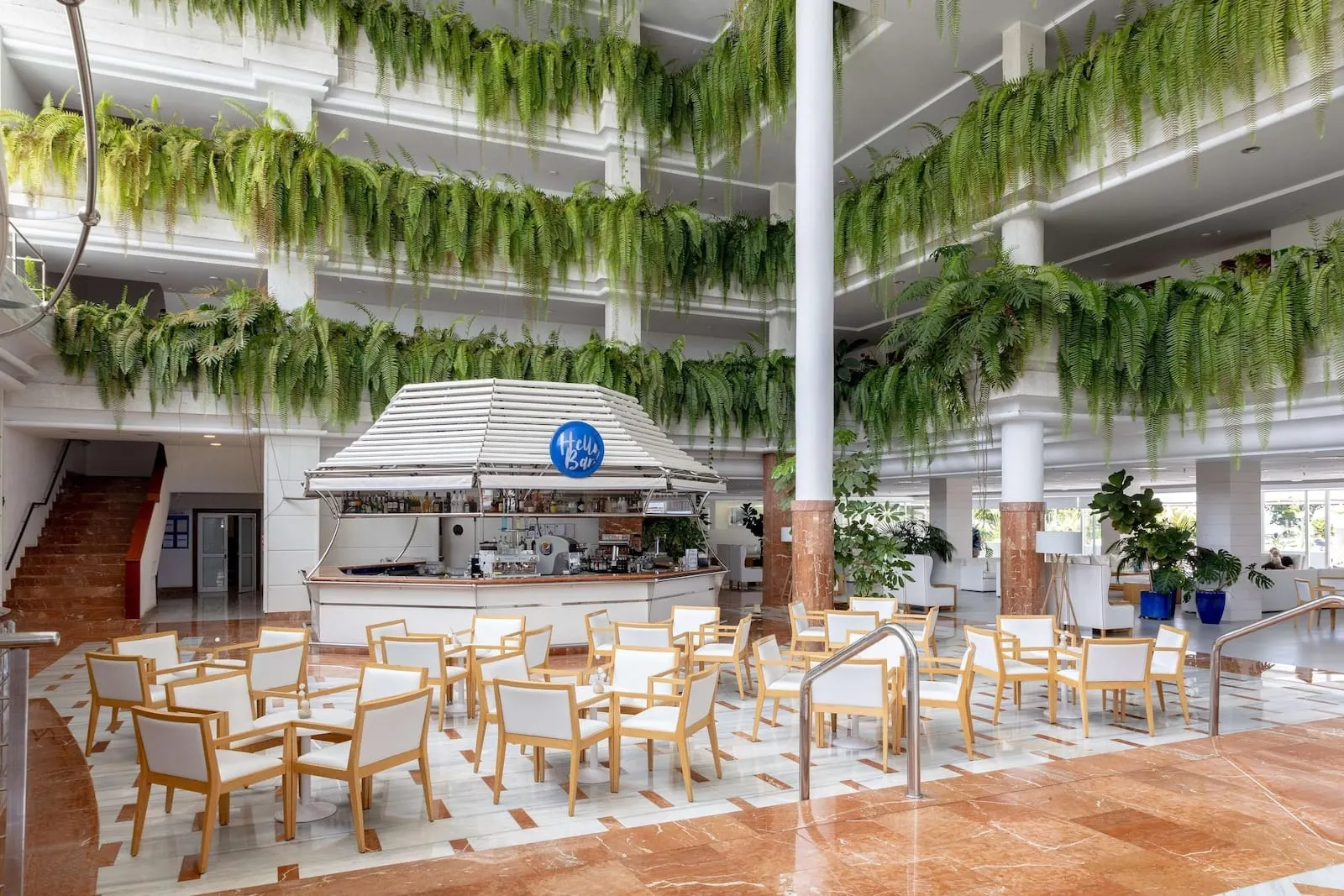 Landmar Playa la Arena: A spacious lobby with multiple seating areas, a central bar