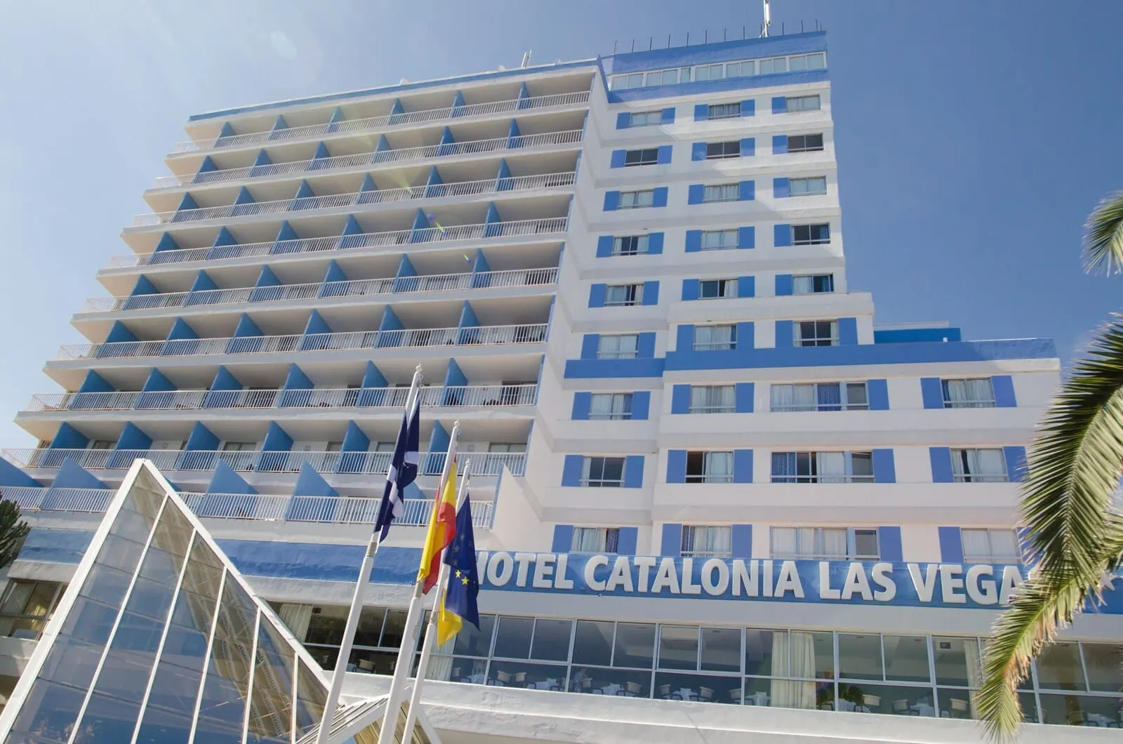 Catalonia Las Vegas: A multi-story hotel with balconies and a clear view of the sky