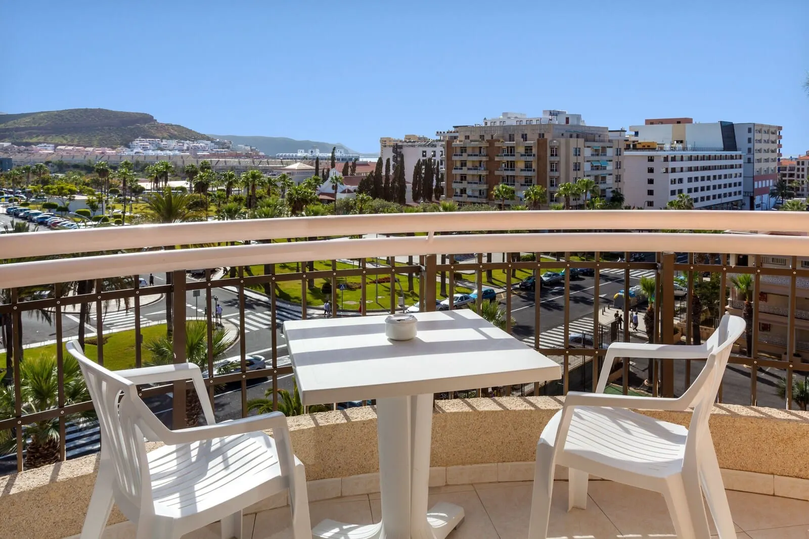 Tigotan Lovers & Friends: A balcony with a table and two chairs
