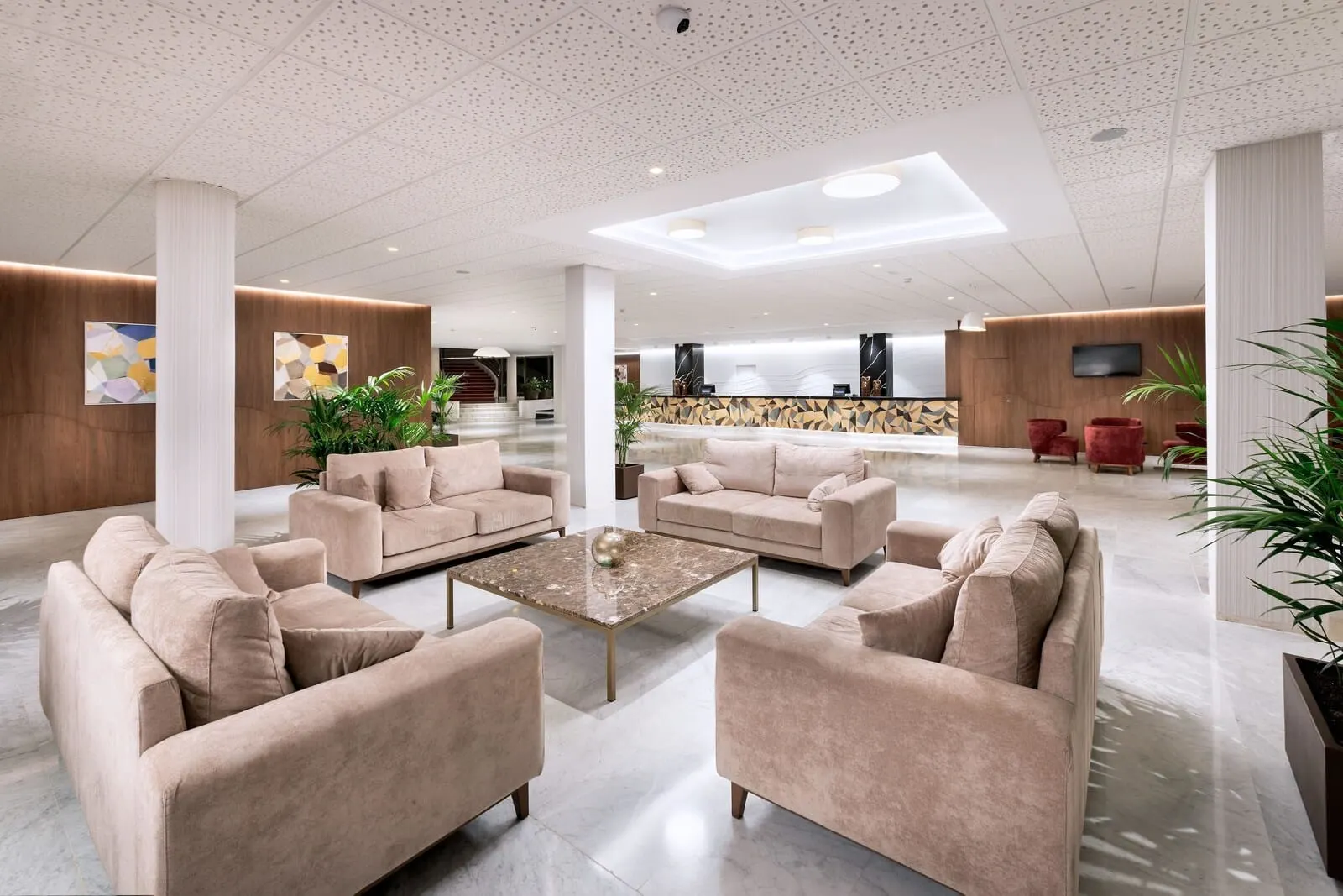 Best Semiramis: A spacious lobby with beige sofas, a central coffee table