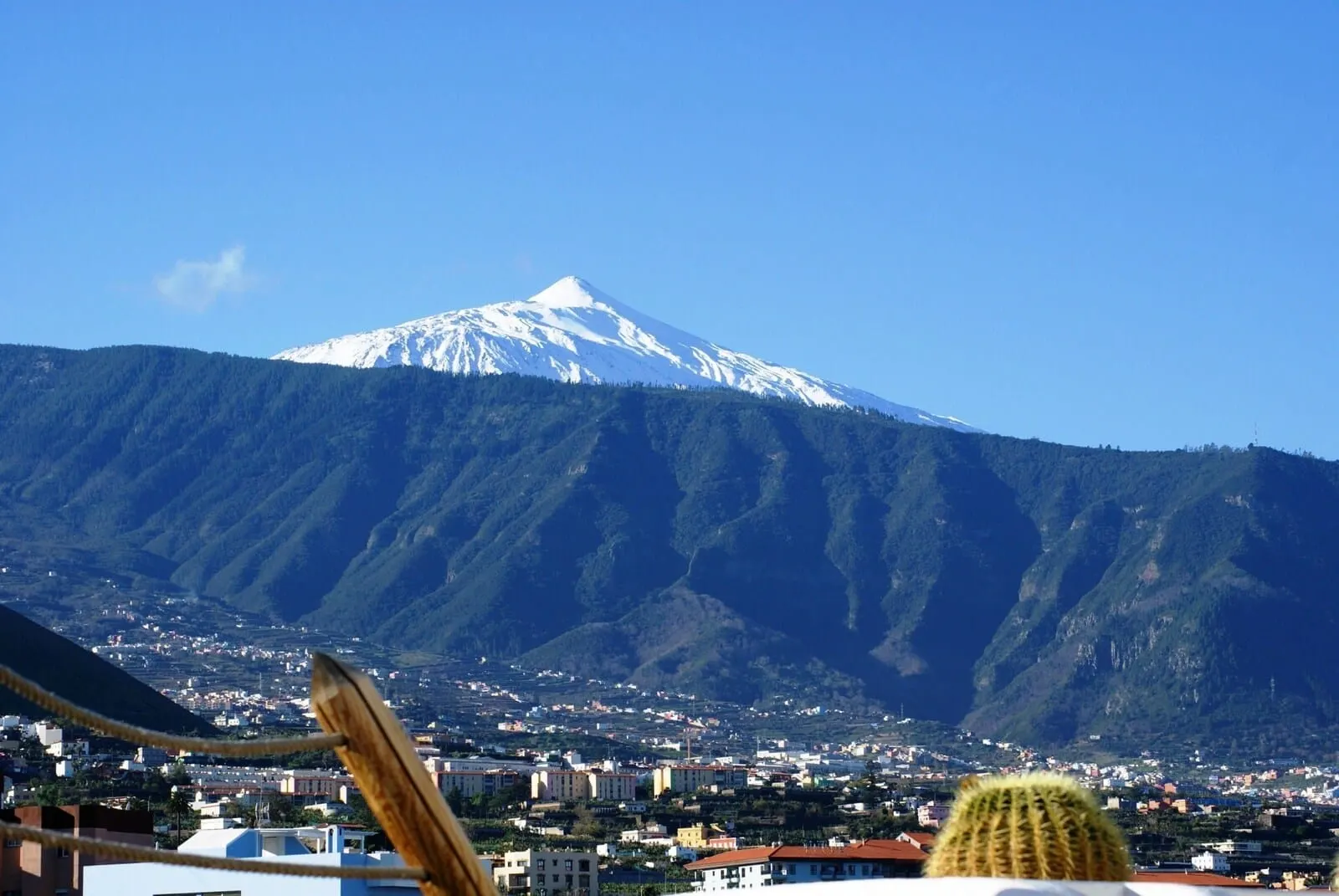Marquesa Hotel: A mountain with a snow-capped peak in the background, a town in the foreground