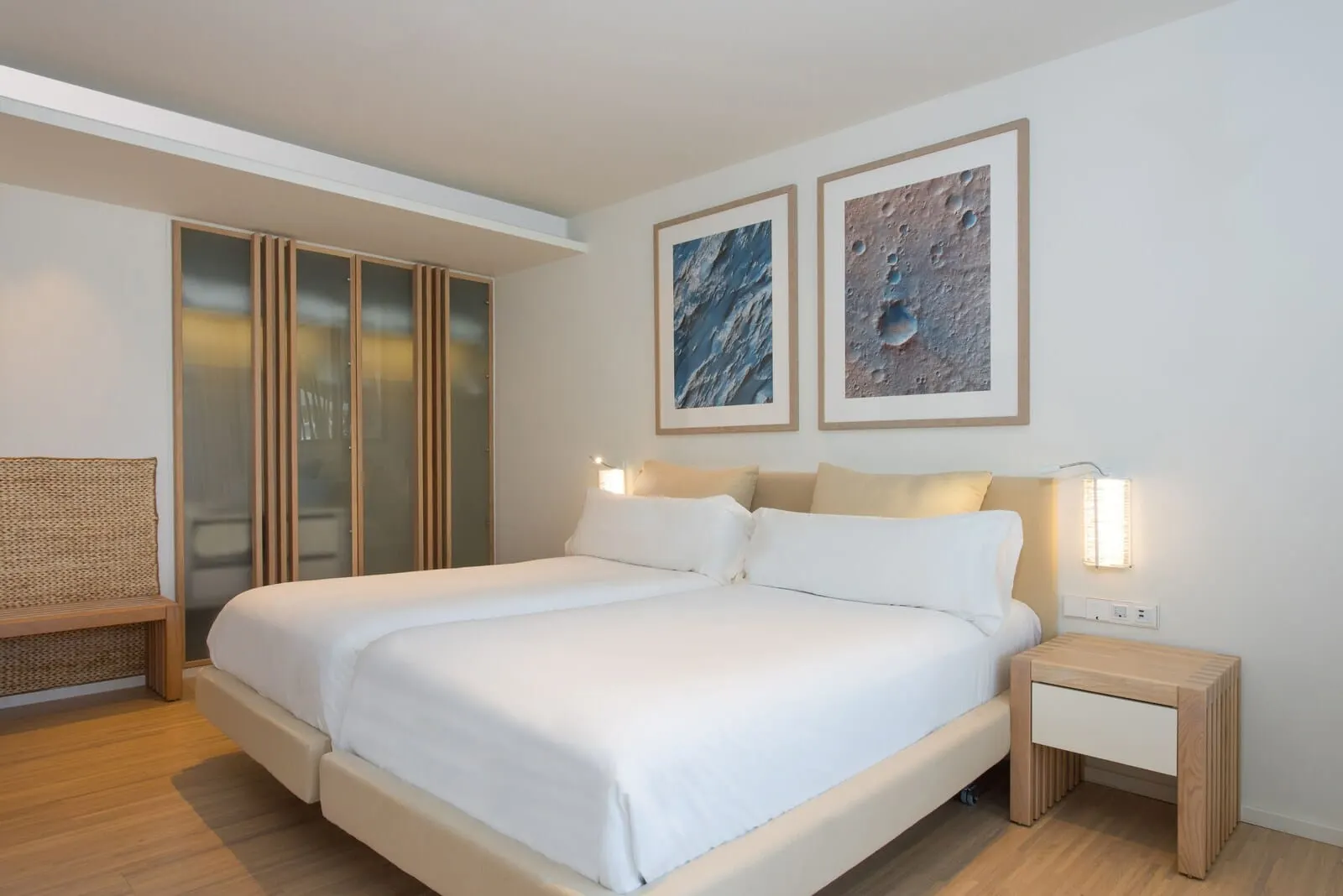 JOIA Salomé by Iberostar: A modern hotel room with a large bed, a wooden bench