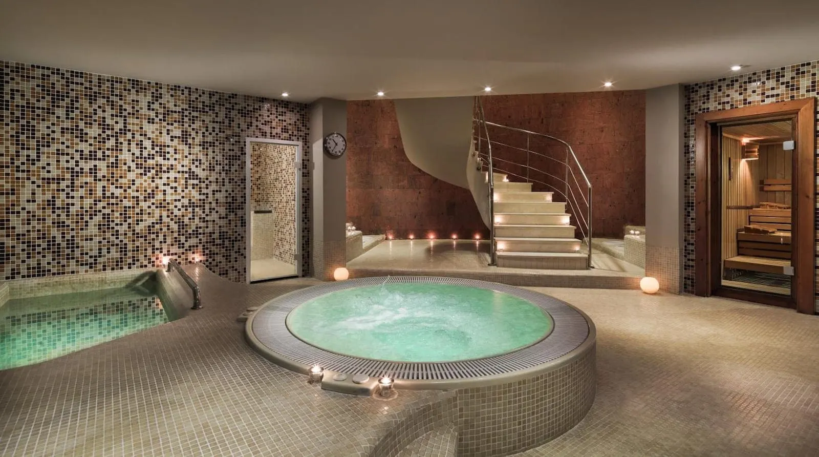 1881 Tenerife Madrigueras Golf Hotel: A spa area with a hot tub, a staircase, and a wooden sauna