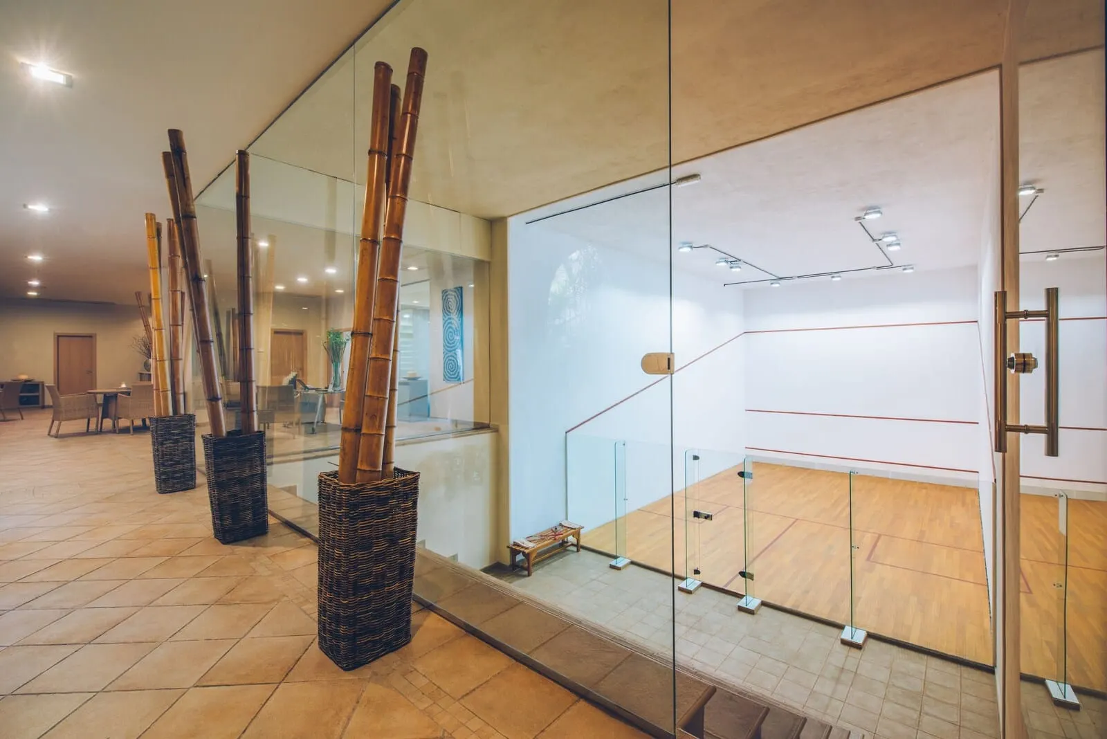 JOIA El Mirador by Iberostar: A modern indoor space with a glass partition, wooden flooring