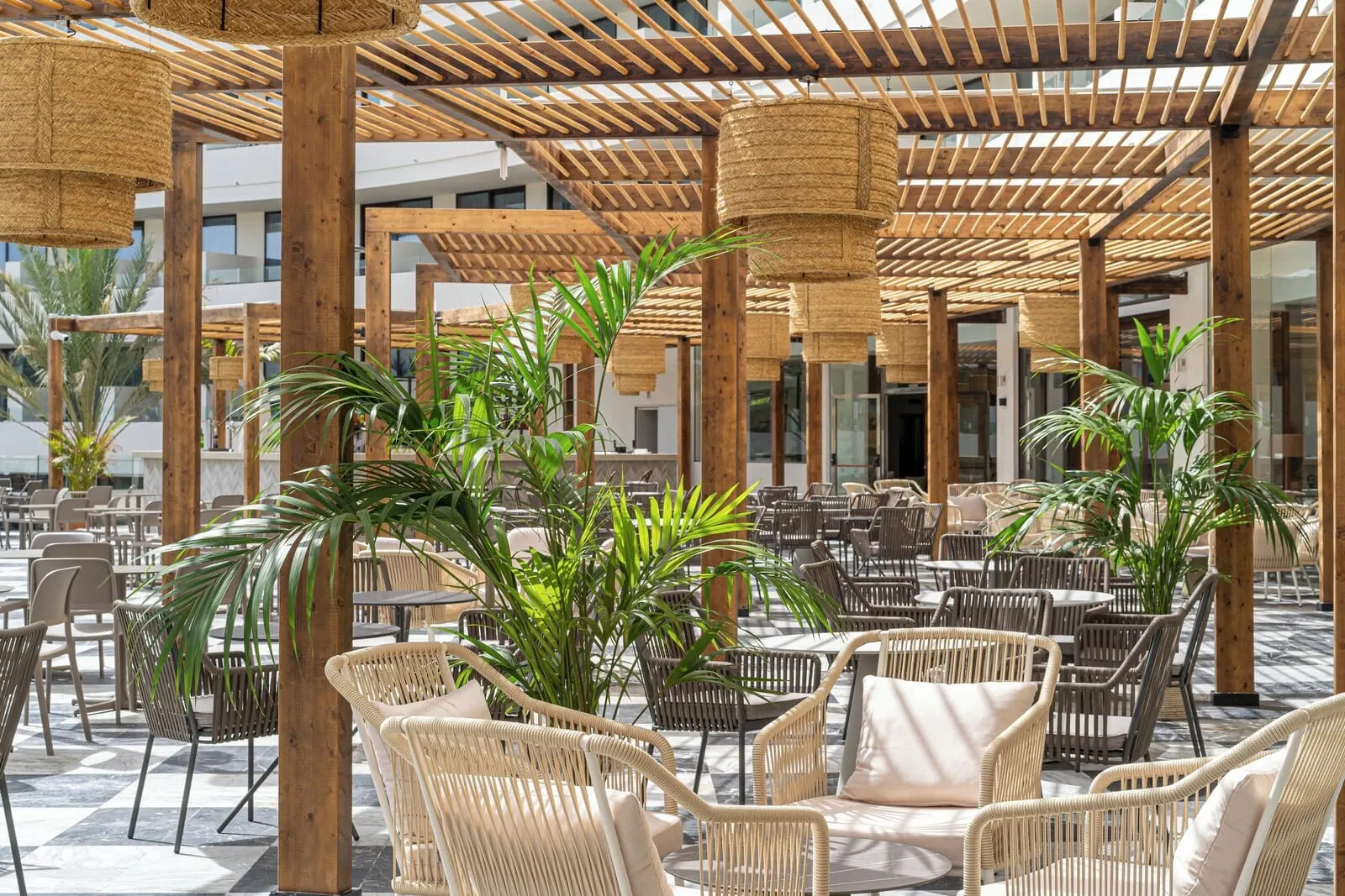 Mediterranean Palace: An outdoor seating area with wicker chairs and tables