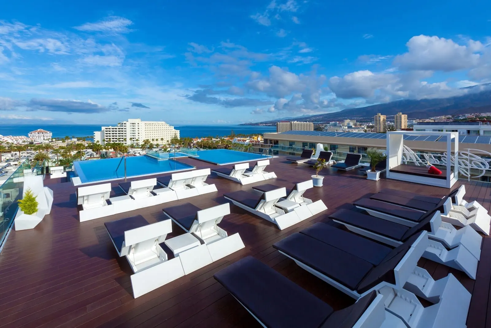 Tigotan Lovers & Friends: A rooftop pool area with sun loungers and a swimming pool