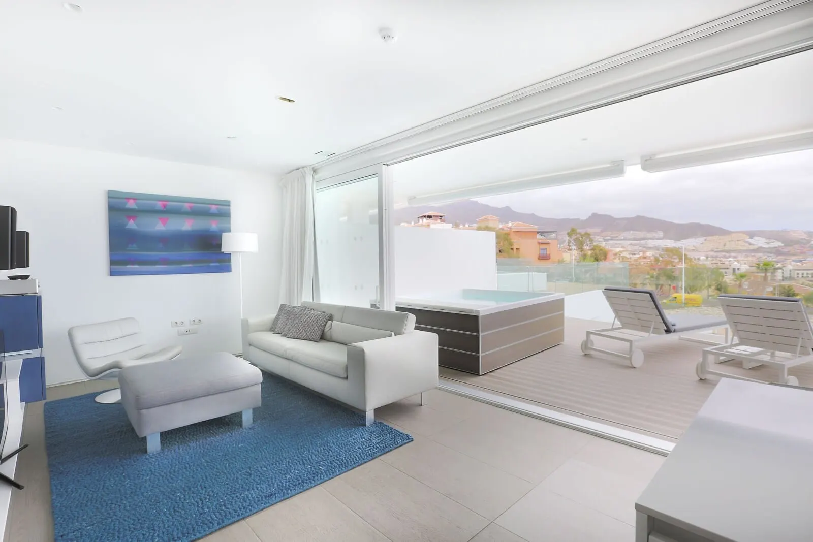 Domes Baobab Suites: A modern living room with a sofa, armchairs, and a coffee table