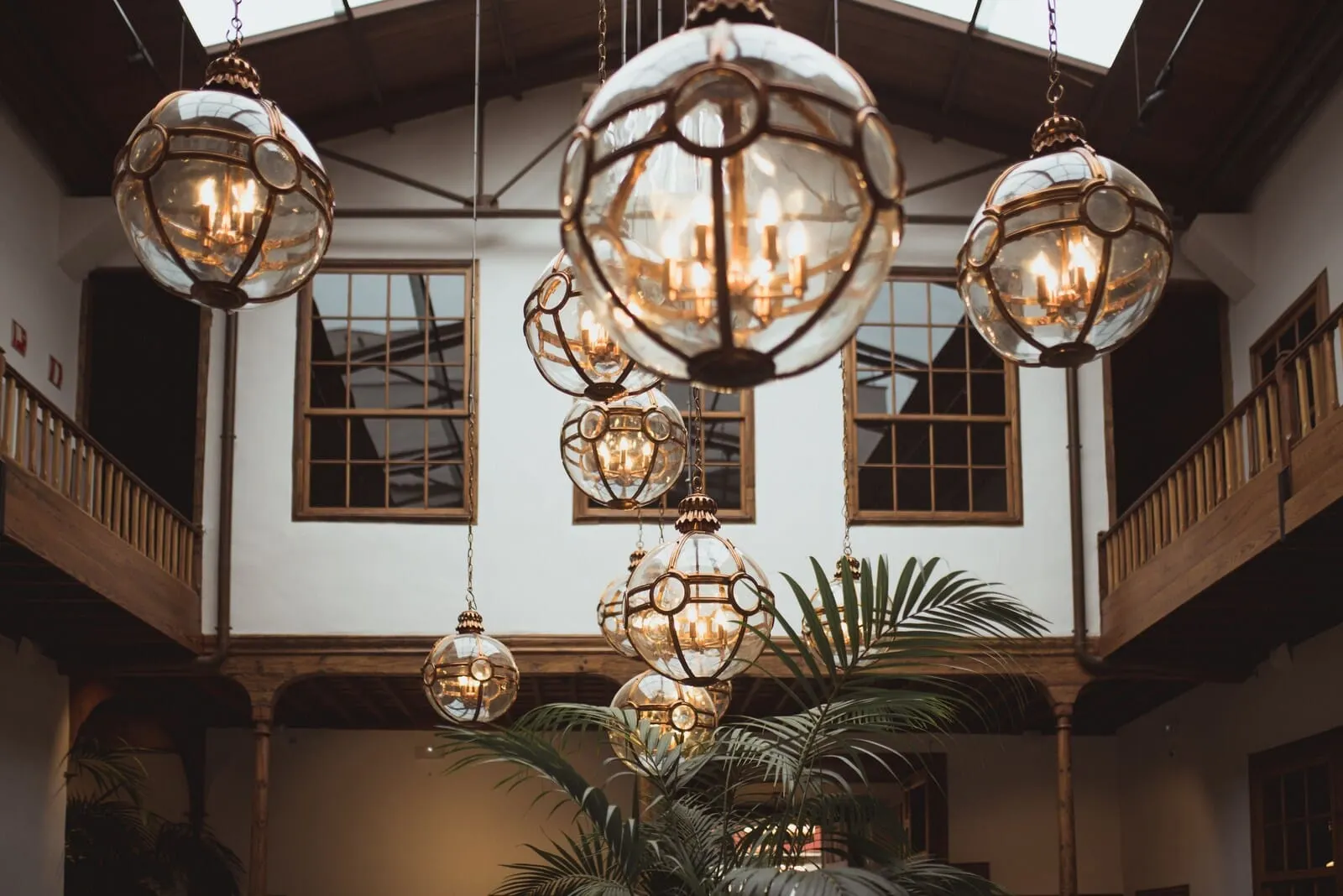 La Laguna Gran Hotel: A spacious interior with multiple hanging spherical chandeliers and large windows