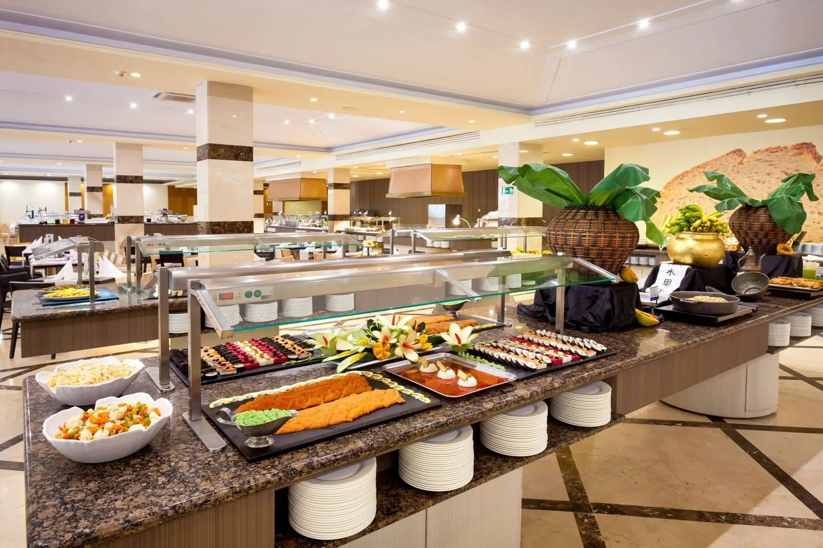 Best Jacaranda: A buffet area with various food stations, including sushi, salads, and desserts