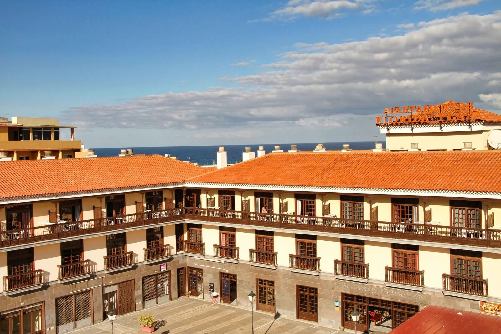 Be Smart Florida Plaza: A multi-story building with balconies and a view of the sea