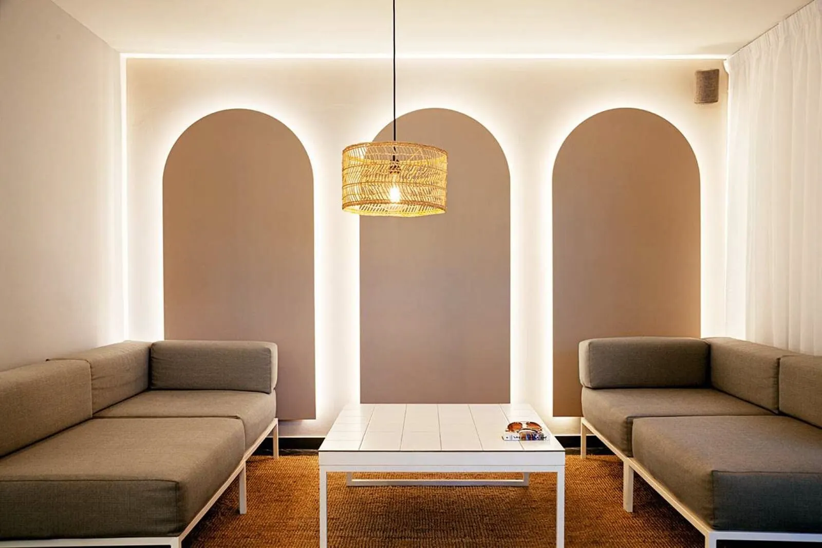 Coral Compostela Beach: A modern living room with a white coffee table, two grey sofas