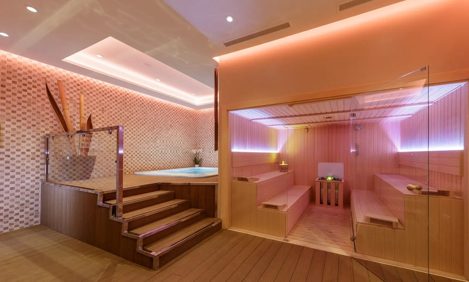 Hotel Suite Villa María: A modern spa with wooden floors, a glass-enclosed sauna, and a visible hot tub