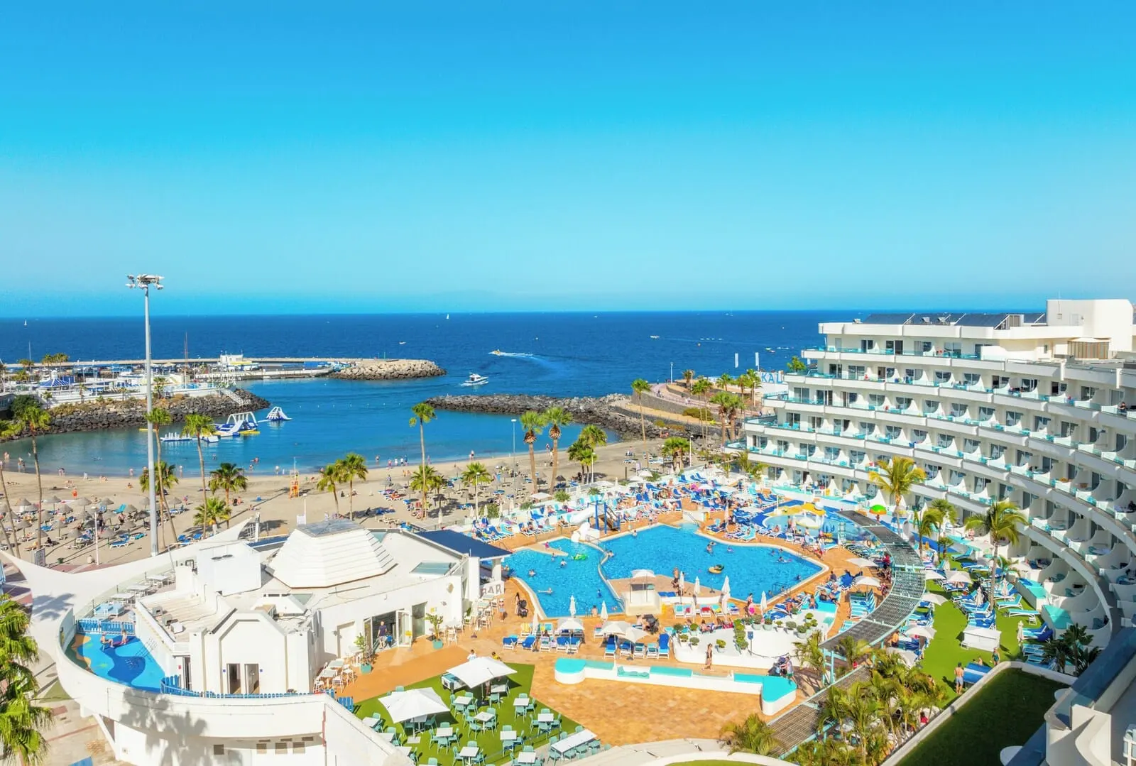 HOVIMA La Pinta Beachfront Family Hotel: A resort with a large pool, beach area, and ocean views