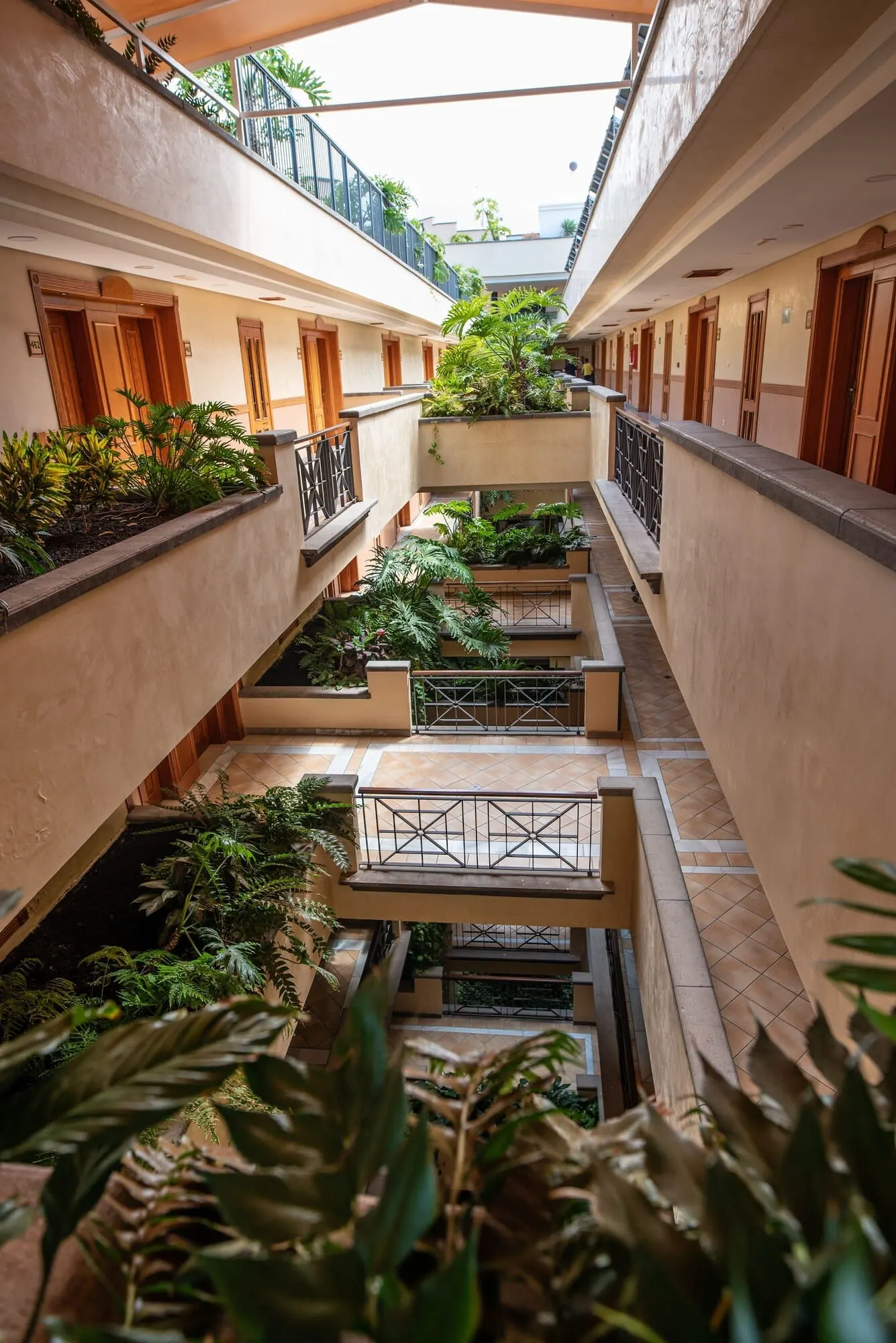 GF Gran Costa Adeje: A multi-level atrium with a central garden area, balconies