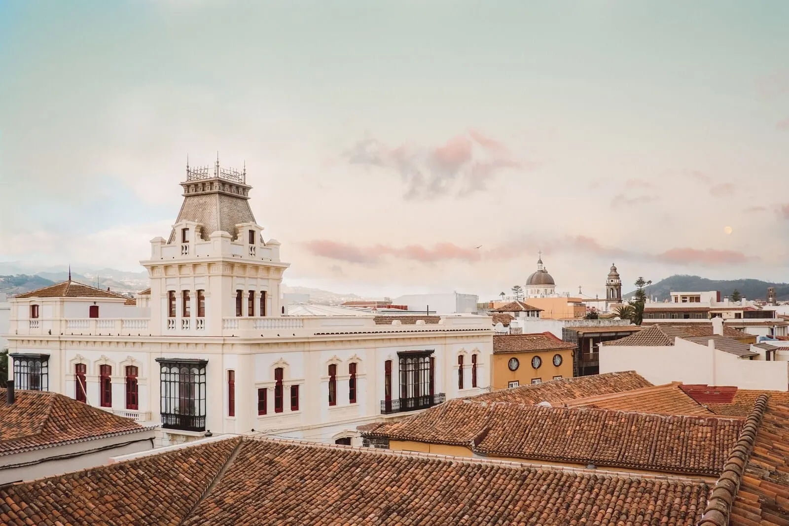 La Laguna Gran Hotel: A historic building with a prominent tower and multiple windows