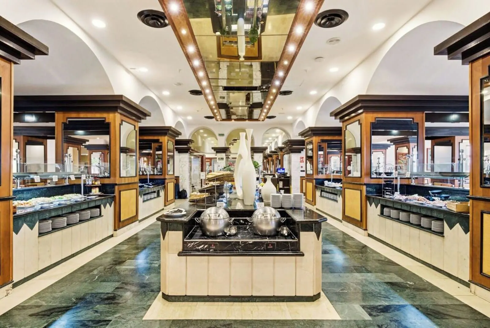 Bahia Principe Explore San Felipe: A buffet area with multiple food stations, a central serving counter