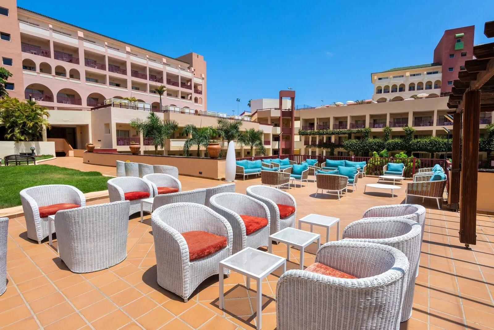 Best Jacaranda: An outdoor seating area with wicker chairs and tables