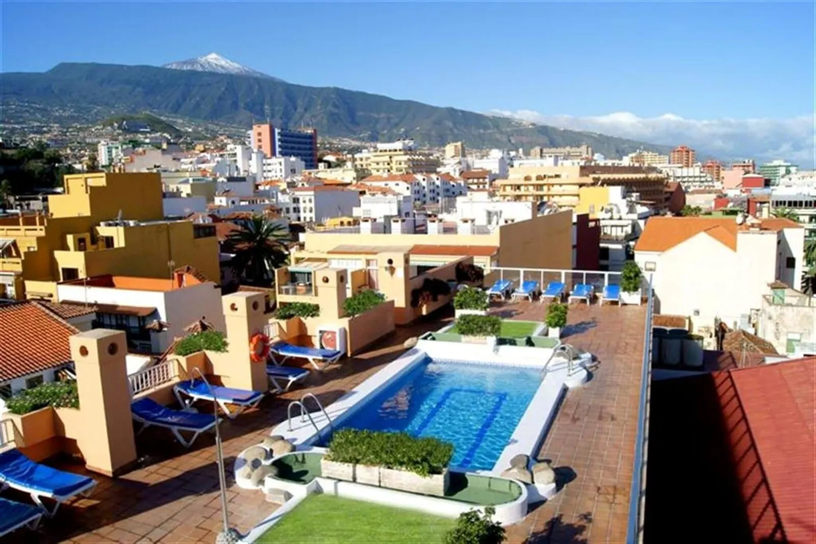 4Dreams Hotel: A rooftop pool area with lounge chairs and a swimming pool