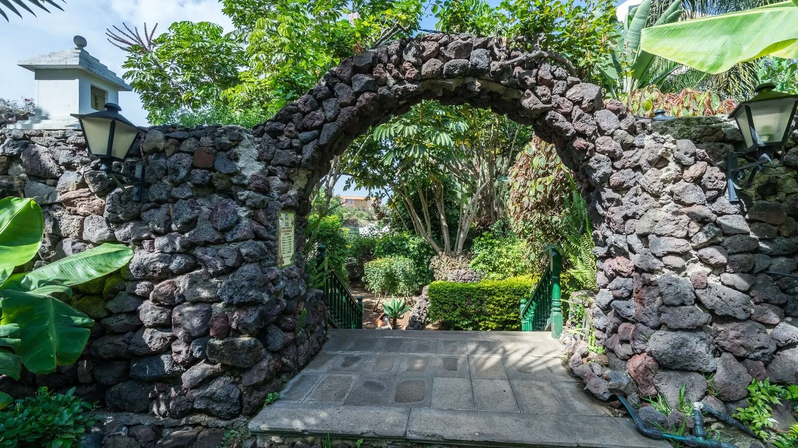 BLUESEA Costa Jardín & Spa: A stone archway leading to a garden with a paved path