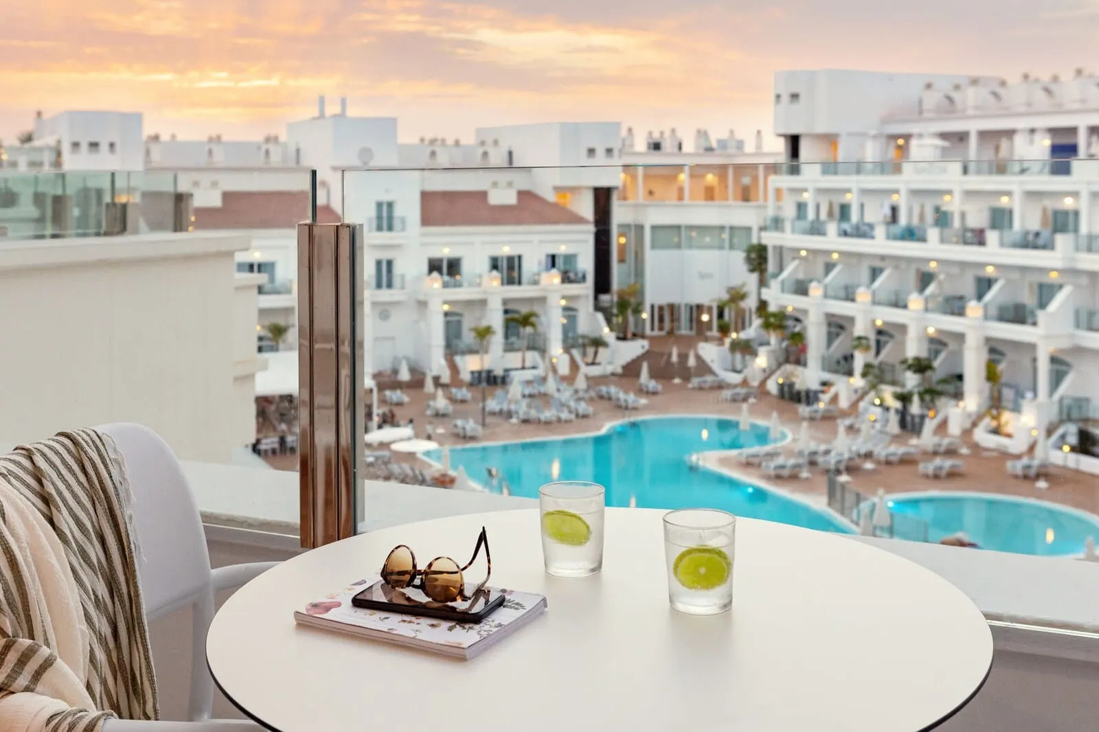 Sunwing Fañabé Beach: A balcony with a view of a swimming pool and hotel buildings