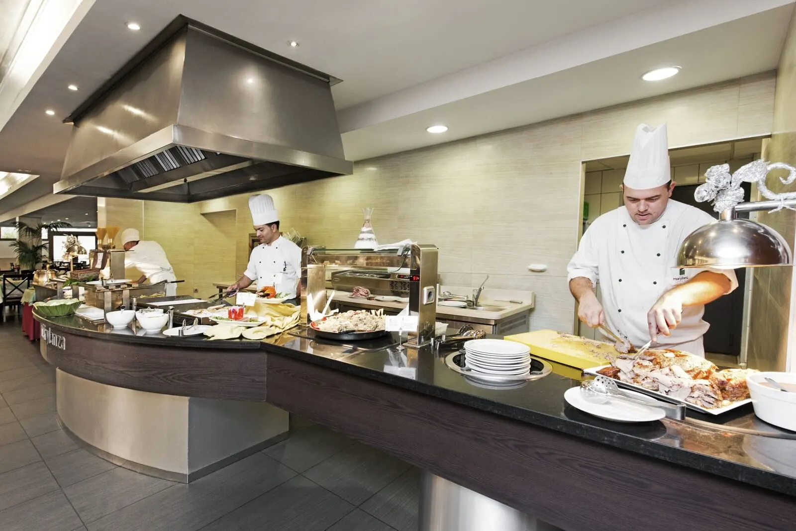 Marylanza Suites & Spa: A modern kitchen with stainless steel appliances and a central island