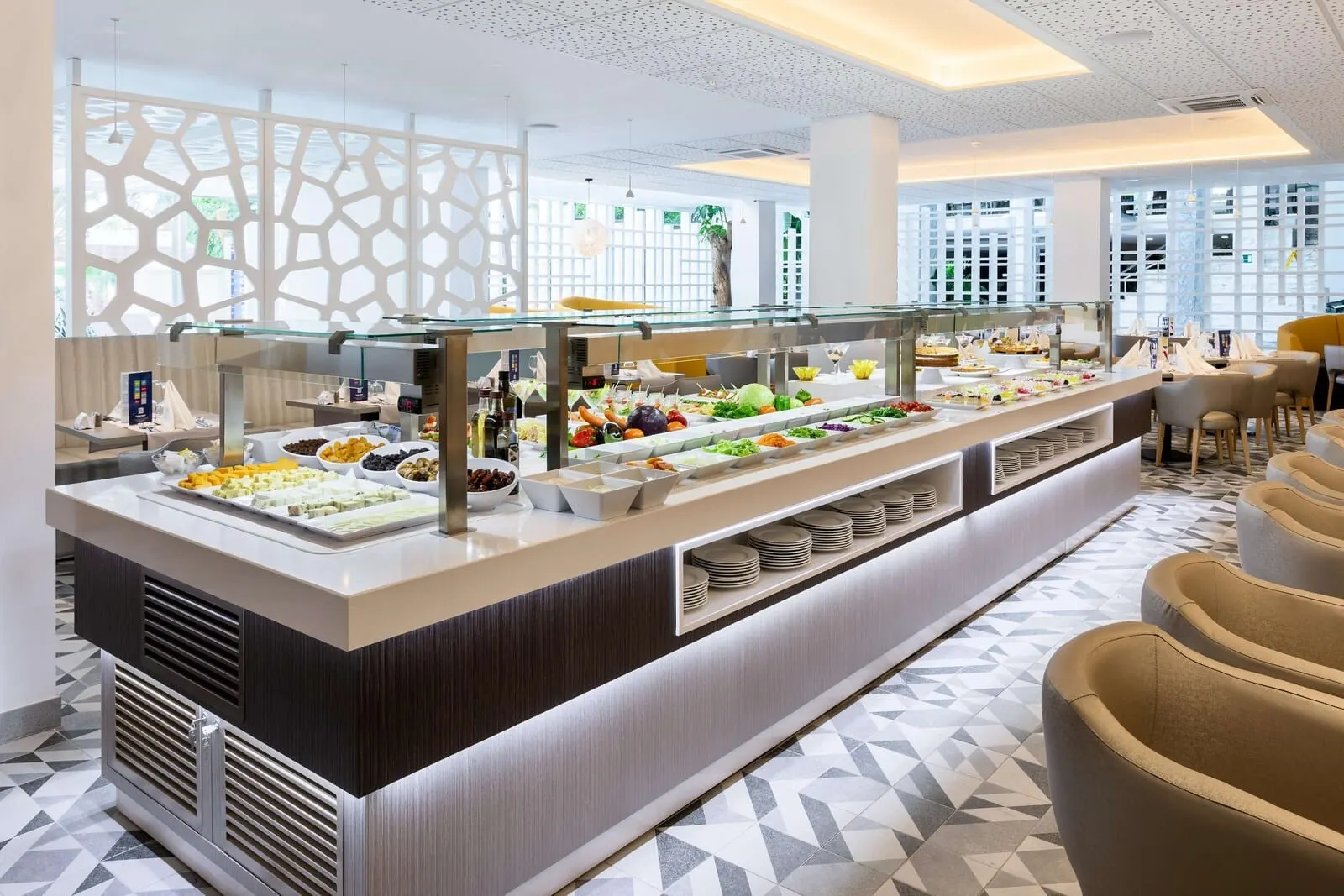 Best Tenerife: A buffet with various food items and a seating area with chairs