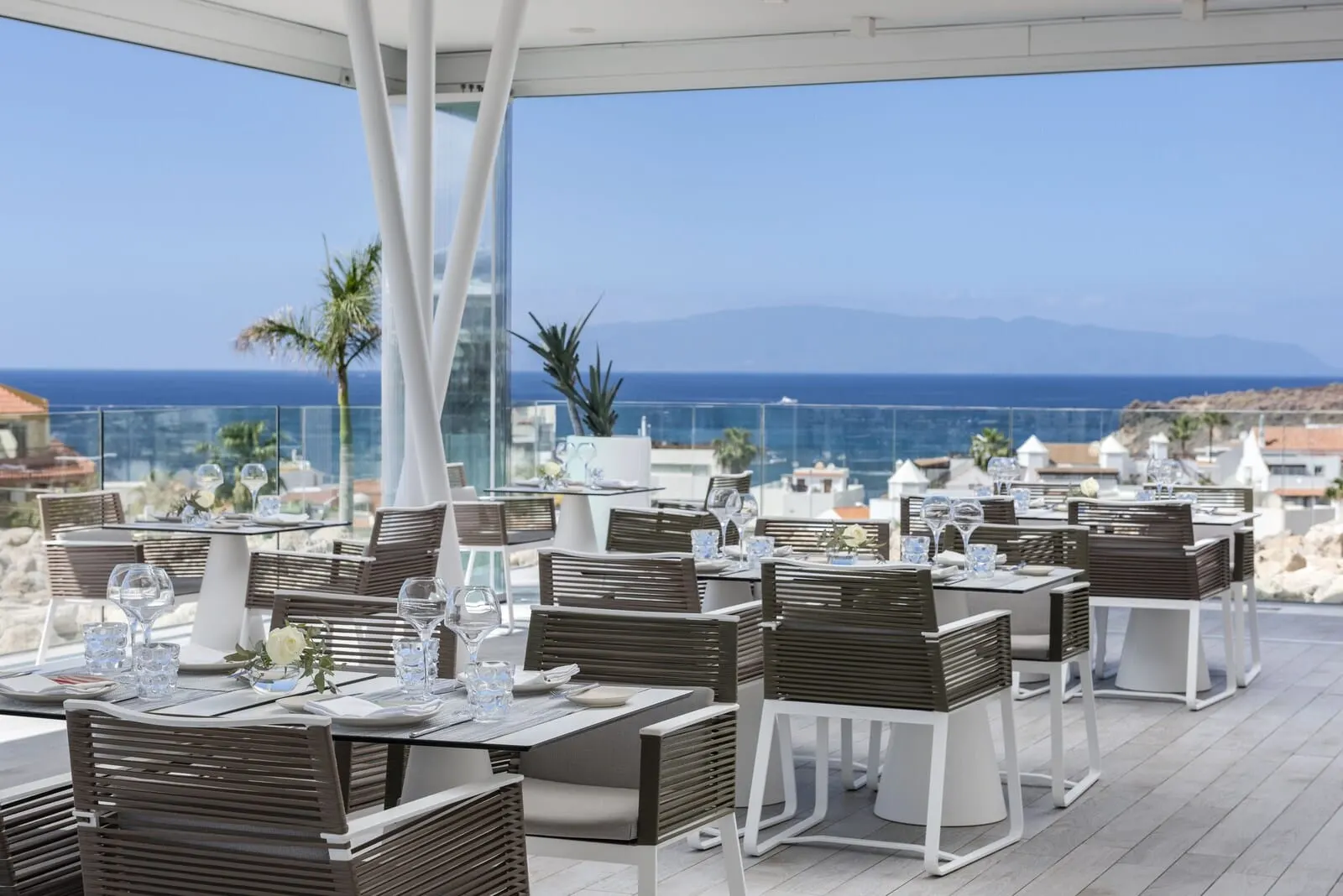 Royal Hideaway Corales Suites: A restaurant with outdoor seating overlooking the sea